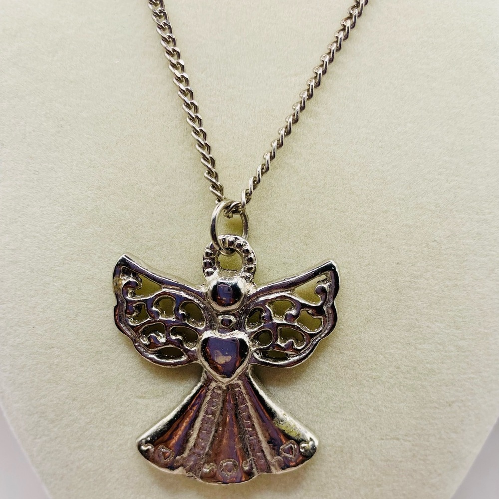 Vintage silver tone angel pendant necklace. 16 inches long. S hook clasp closure